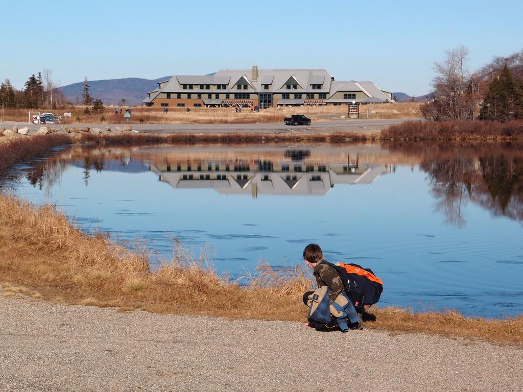 young hiker by Saco Lake on the way to Mount Jackson in NH