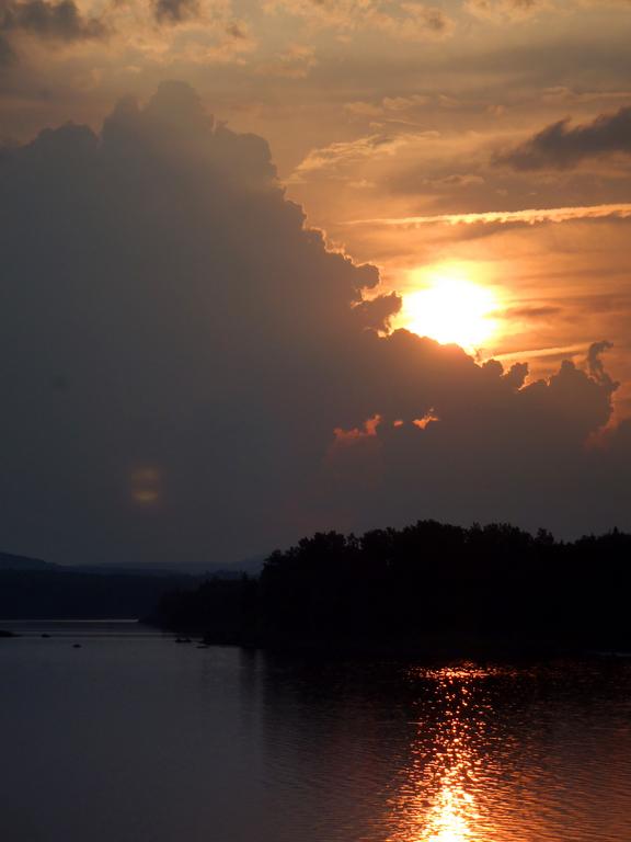 stormy sunset over Wood Pond as seen from the town of Jackman in Maine