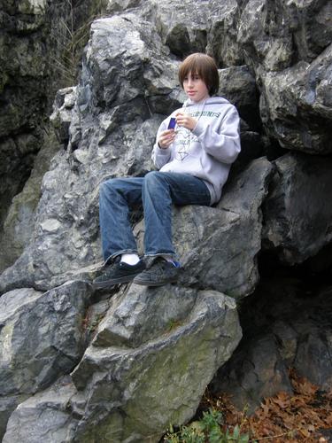 hiker on Dungeon Rock at Lynn Woods Reservation in Massachusetts