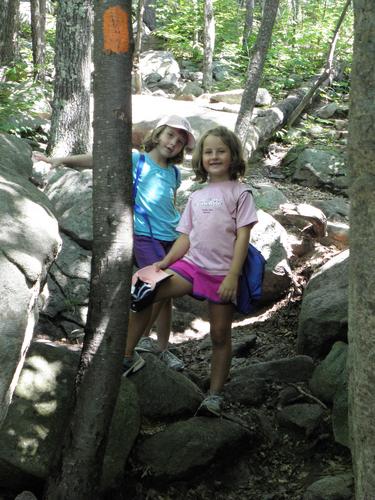 hikers on the Boulder Loop Trail to Mount Major in New Hampshire