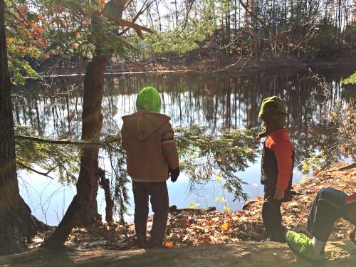 kids at the water's edge at Mine Falls Park in New Hampshire