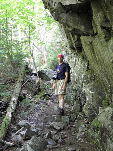 hiker on the trail to Monadnock Mountain in Vermont