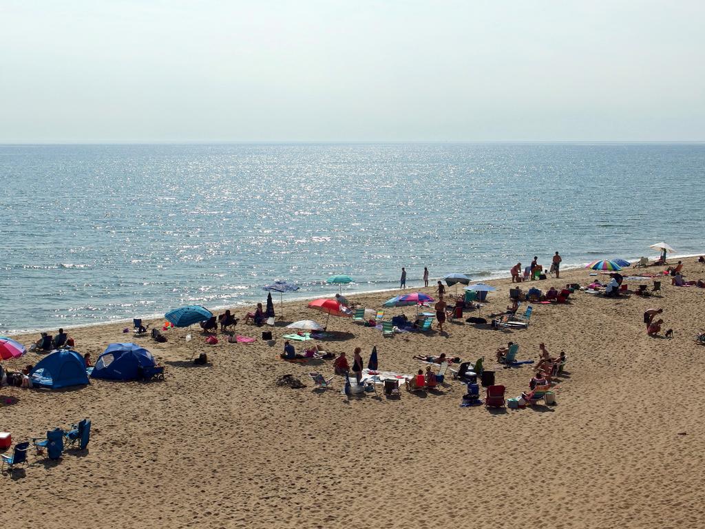 morning visitors enjoy Nauset Beach at Cape Cod National Seashore on the outer coast of Cape Cod in eastern Massachusetts