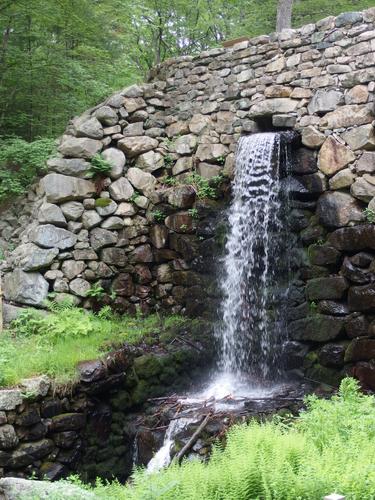 old mill site and waterfall on Lower Mill Pond at Noanet Woodlands in eastern Massachusetts