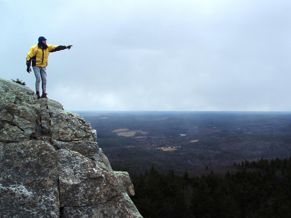 Dick in March atop the south-vista cliff on North Pack Monadnock Mountain in New Hampshire