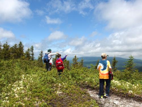 hikers checking out the view from The Nubble in the White Mountains of New Hampshire