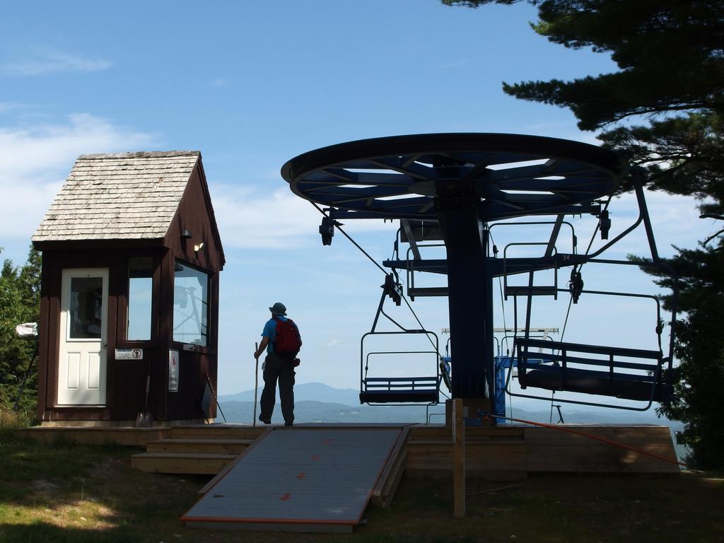 John steps up to the view on the top of the ski lift at Pats Peak in New Hampshire