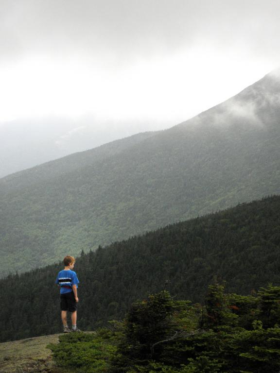 Carl stands out on the edge near the summit of Mount Pierce in New Hampshire