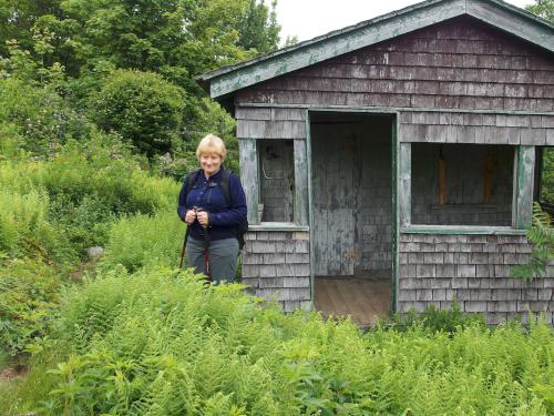 Andee at the Fire Warden's cabin on Pitcher Mountain in New Hampshire