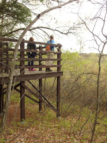 hikers on the Ponemah Overlook Observation Deck at Ponemah Bog in southern New Hampshire