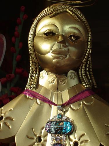 gold statue in a Portsmouth shop window in New Hampshire