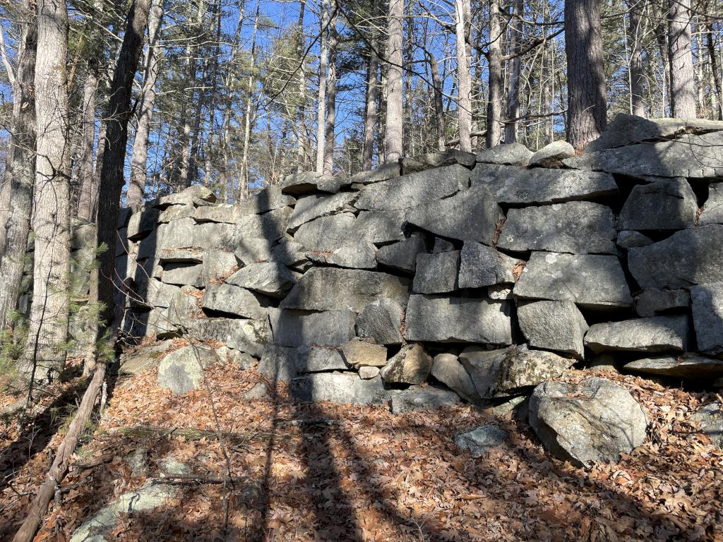 rock wall in December at Lake Potanipo Trail near Brookline in southern NH