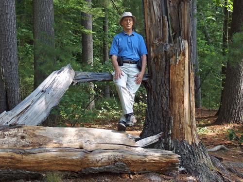 Fred on a fallen tree beside the Rockingham Recreational Trail in southern New Hampshire