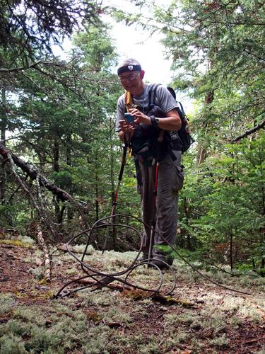 Dick photographs the support cable from an old fire tower on Russell Mountain in New Hampshire