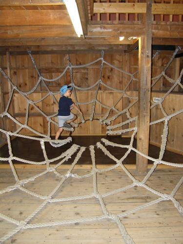 young visitor on the climbing web at Squam Lakes Natural Science Center in New Hampshire