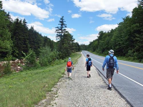 Carl, Ryzek and Lance walk Route 49 back to our car from Shell Cascade in New Hampshire