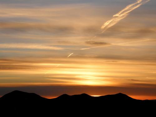 sunset over Mount Passaconaway and Mount Tripyramid as seen from Middle Sister Mountain in New Hampshire