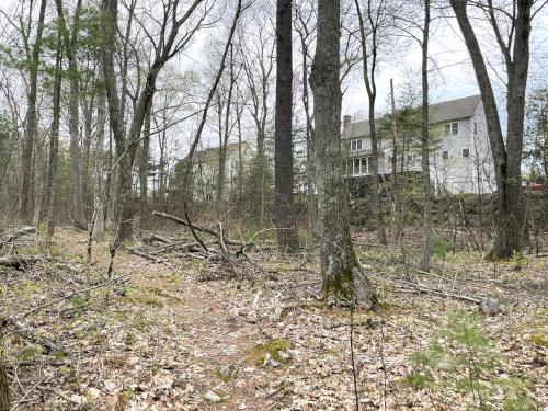 housing beside the trail in May at Skinner Forest in northeast MA