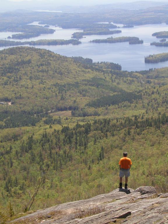 hiker and view from Mount Percival in New Hampshire