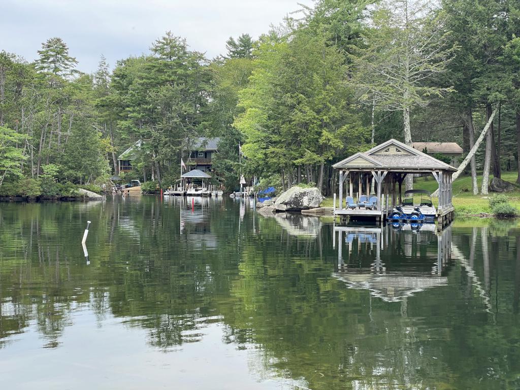 houses on the far side of Sally's Gut in September at Stonedam Island on Lake Winnipesaukee in NH