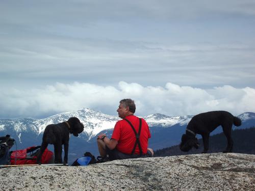 hikers on the summit of North Sugarloaf Mountain in New Hampshire