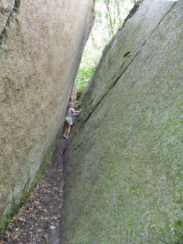 young hikers exploring boulders on the trail to Middle Sugarloaf Mountain in New Hampshire