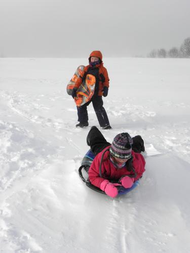 sledders at Benedictine Park in New Hampshire