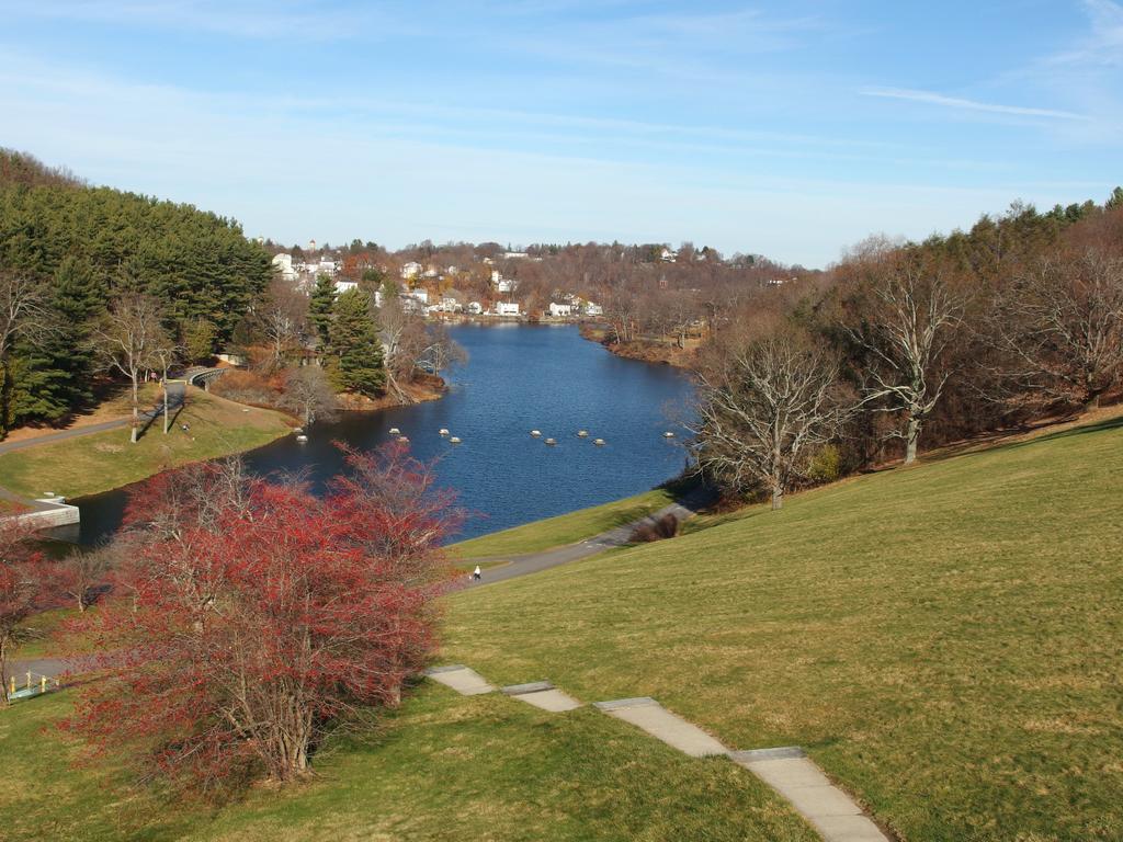 view from the edge of Wachusett Reservoir dam down to the Nashua River and the distant town of Clinton, Massachusetts