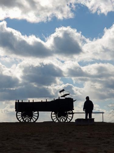 Betty Lou stands beside the iconic wagon at Wagon Hill Farm in coastal New Hampshire