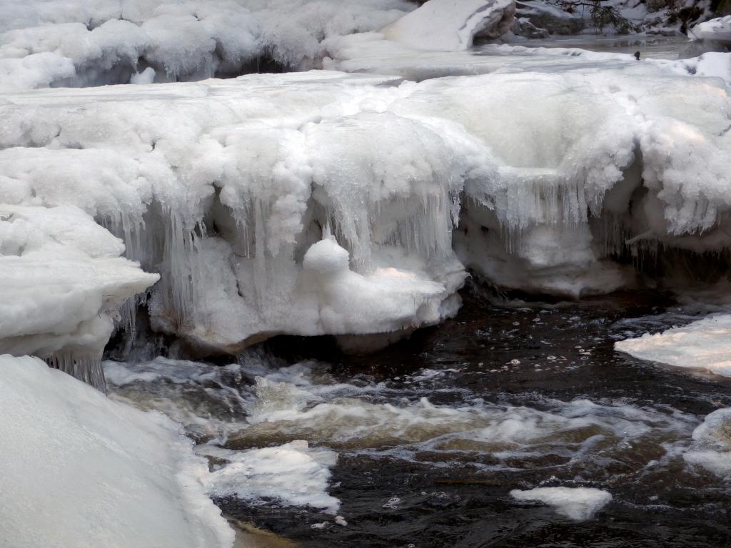 puffy icebergs in February on Gridley River at Wales Preserve in southern New Hampshire