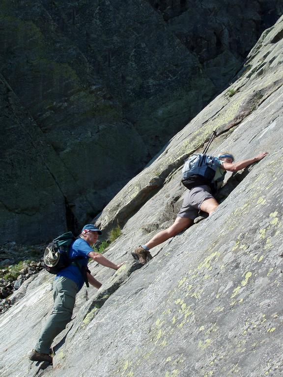 hikers ascending a scary section of the Huntington Ravine Trail to Mount Washington in New Hampshire