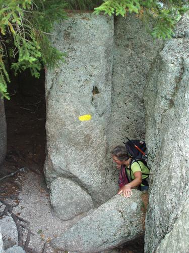 passage through boulders on the trail to Welch Mountain in New Hampshire