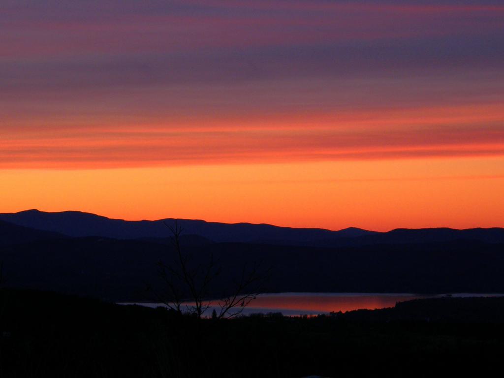 orange sunset as seen from Whiteface Mountain near Lake Winnipesaukee in New Hampshire