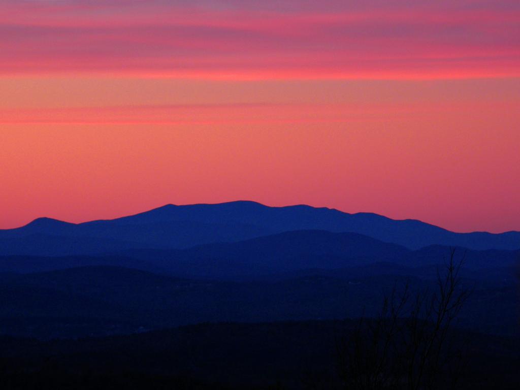 red sunset as seen from Whiteface Mountain near Lake Winnipesaukee in New Hampshire