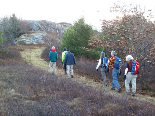 hikers nearing the summit of Winn Mountain in New Hampshire