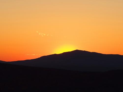 fiery sunset behind Mount Monadnock as seen from Winn Mountain in southern New Hampshire