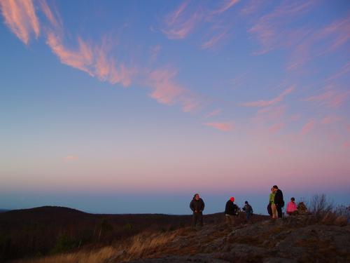 sunset hikers on top of Winn Mountain in New Hampshire