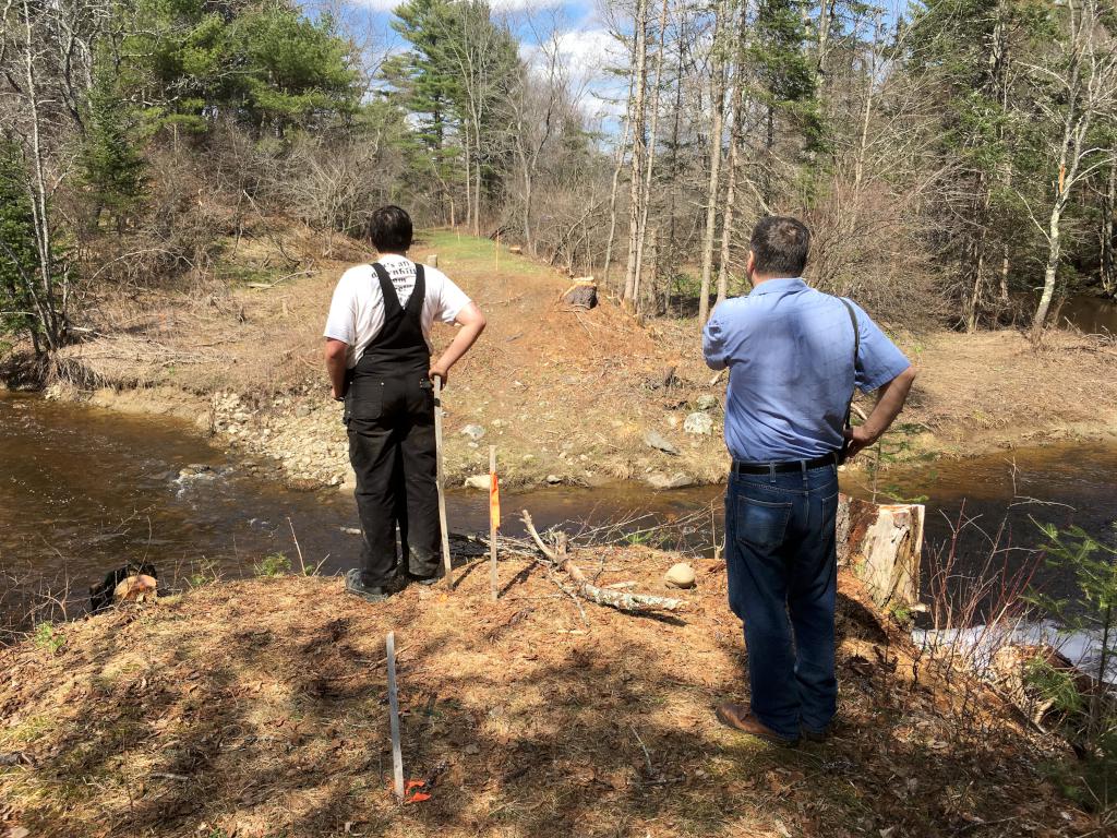 Joseph and Martin look over Trout Brook where a bridge is needed at Wiscasset Railroad in Maine