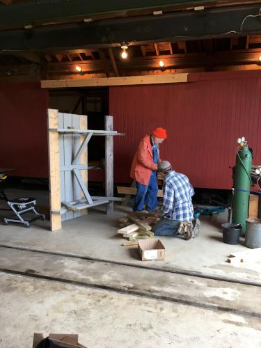 volunters at work inside the mainenance building at Wiscasset Railroad in Maine