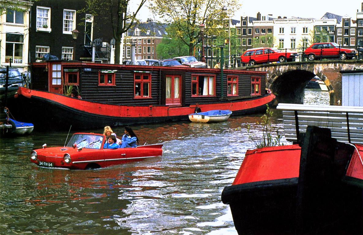 postcard of unusual watercraft in a canal in Holland in April 1996