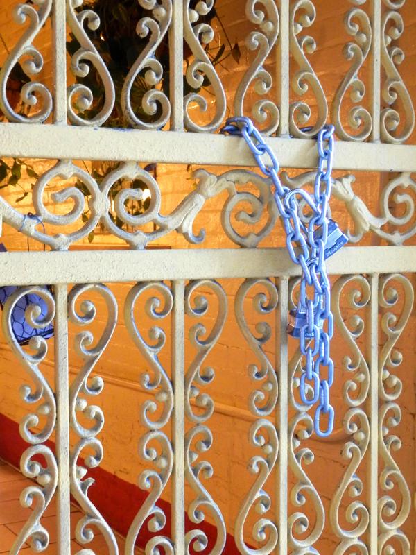 a locked gate looks like modern art along the sidewalk in New York City