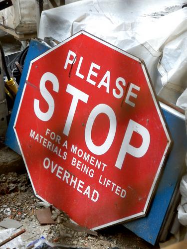 skyscraper-specific stop sign in a construction area at New York City